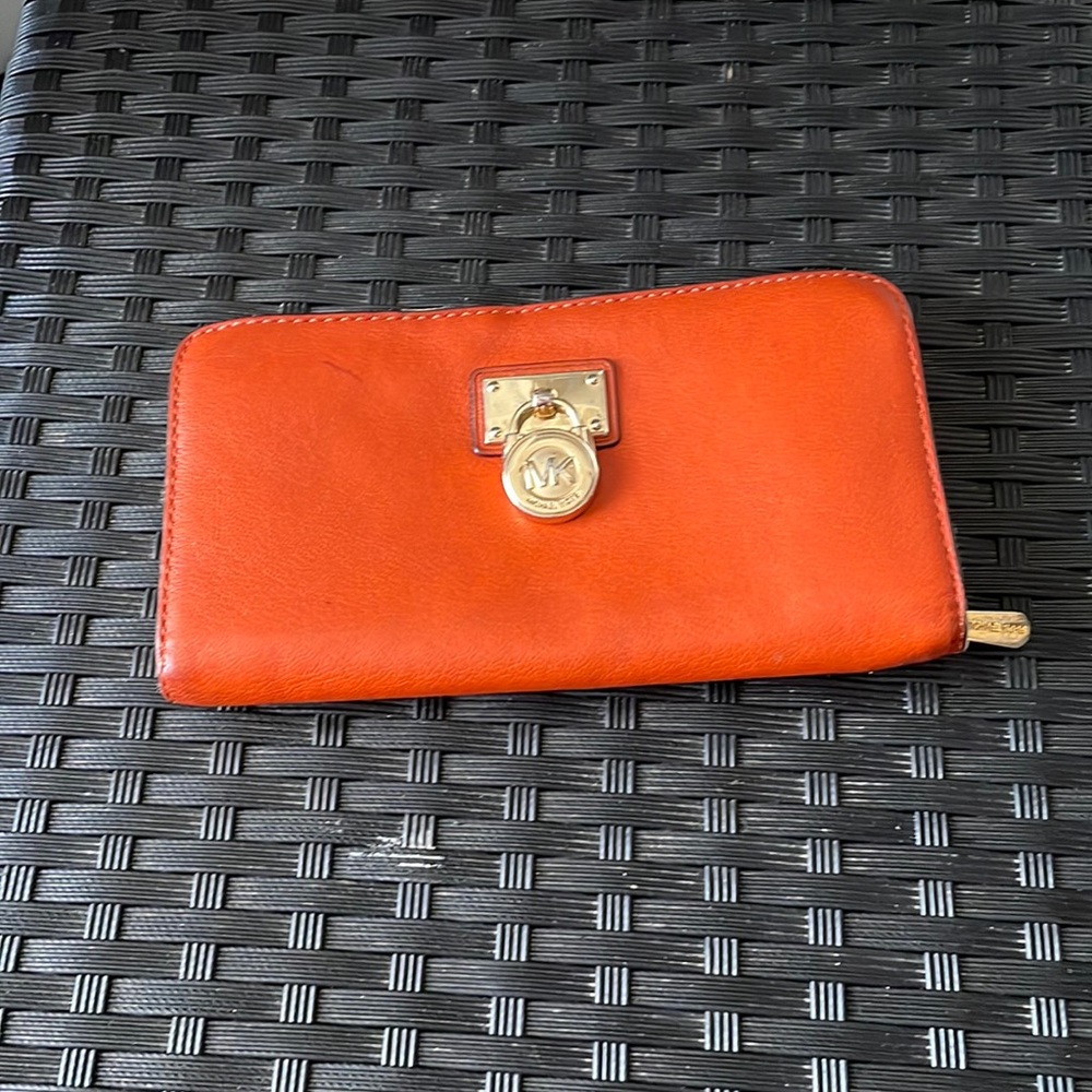 COPY - COPY - Michael Kors wallet and the colour is orange with a gold padlock …